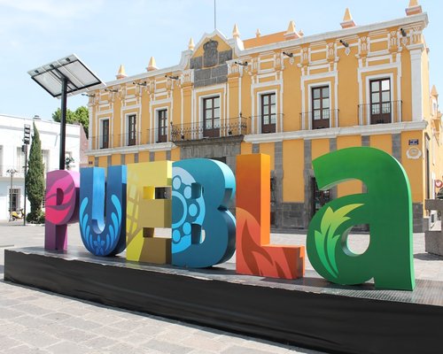 Historical center of Puebla with volcanic landscapes in the background